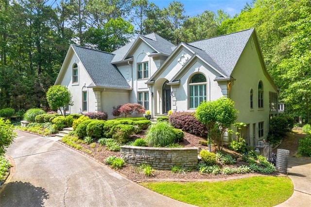 312 Crabapple Springs Way, Woodstock, GA 30188 - view of front of property with a shingled roof and stucco siding