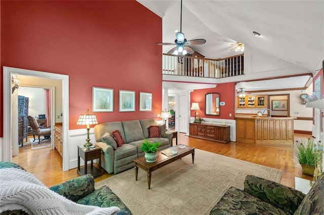312 Crabapple Springs Way, Woodstock, GA 30188 - living room with ceiling fan, high vaulted ceiling, and light wood-type flooring