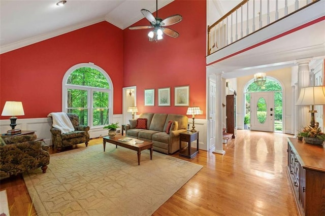 312 Crabapple Springs Way, Woodstock, GA 30188 - living area with ornate columns, wood finished floors, ceiling fan, high vaulted ceiling, and wainscoting