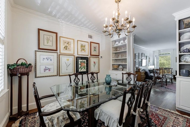 2260 Peachtree Rd NW Unit B4, Atlanta, GA 30309 - dining room with wood finished floors, a chandelier, and ornamental molding