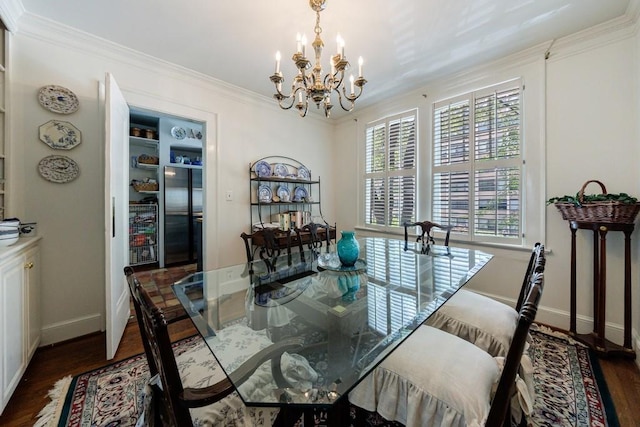 2260 Peachtree Rd NW Unit B4, Atlanta, GA 30309 - dining area featuring a chandelier, dark wood finished floors, and crown molding