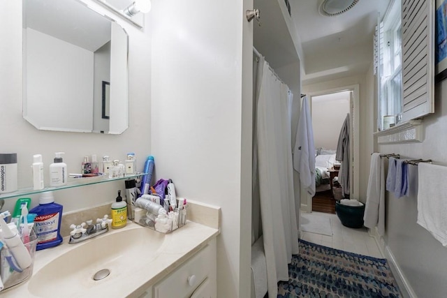 2260 Peachtree Rd NW Unit B4, Atlanta, GA 30309 - ensuite bathroom featuring vanity, tile patterned floors, and curtained shower