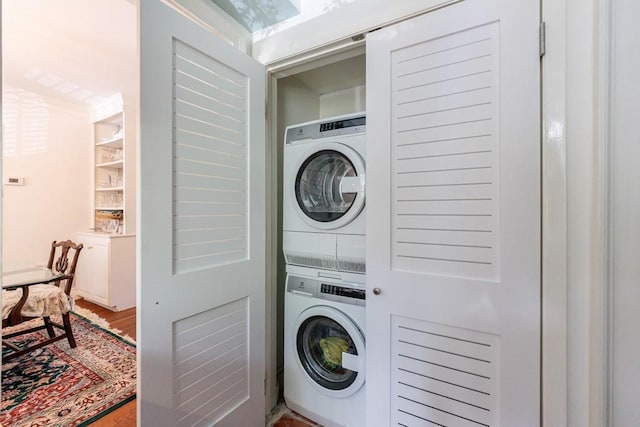 2260 Peachtree Rd NW Unit B4, Atlanta, GA 30309 - laundry room with stacked washer / drying machine and crown molding