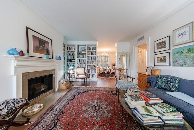 2260 Peachtree Rd NW Unit B4, Atlanta, GA 30309 - living area with a chandelier, wood finished floors, a fireplace, and ornamental molding