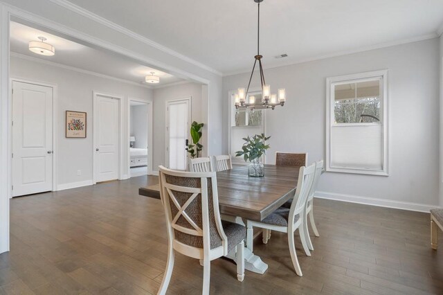 dining space featuring crown molding, dark hardwood / wood-style floors, and ceiling fan