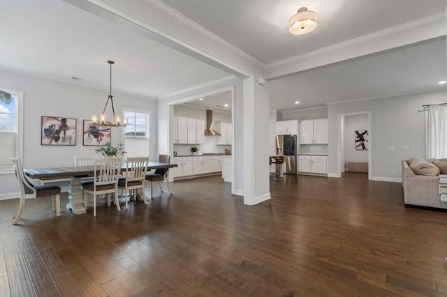 dining area featuring dark wood-type flooring, ornamental molding, and plenty of natural light