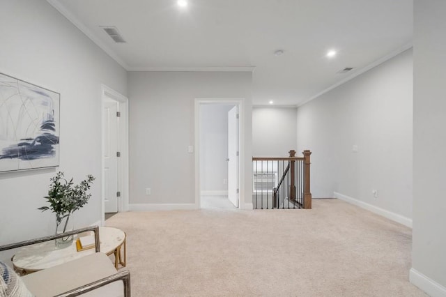 living area featuring ornamental molding, an upstairs landing, carpet, and visible vents