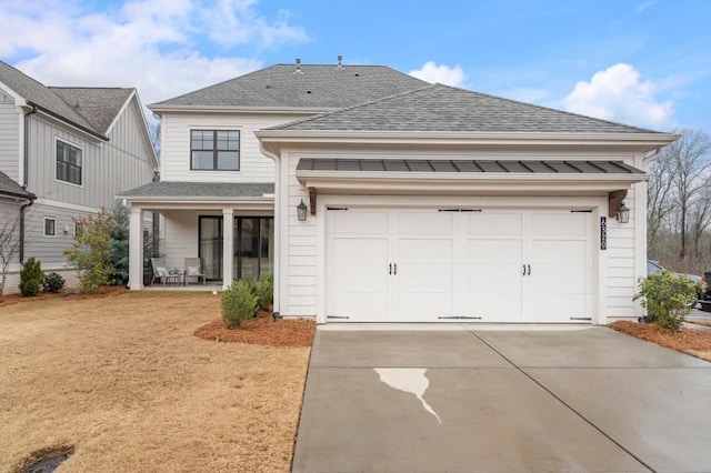 view of front of property featuring a garage, concrete driveway, a porch, and roof with shingles