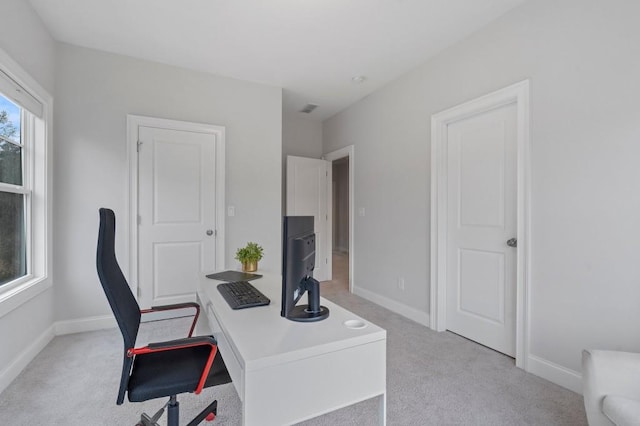 office area featuring light colored carpet