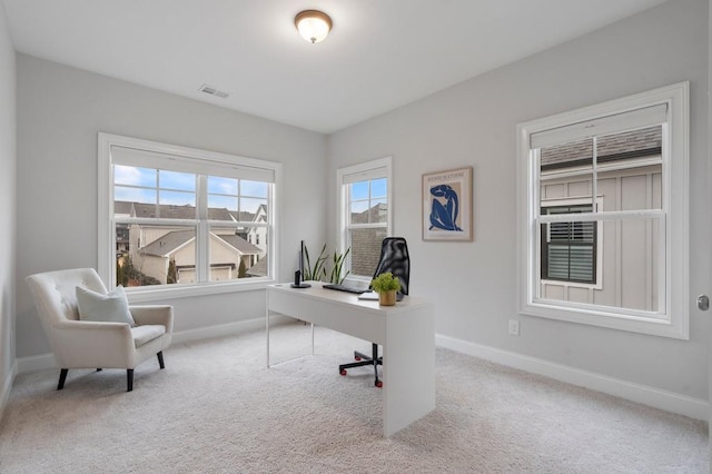office with carpet floors, baseboards, and visible vents