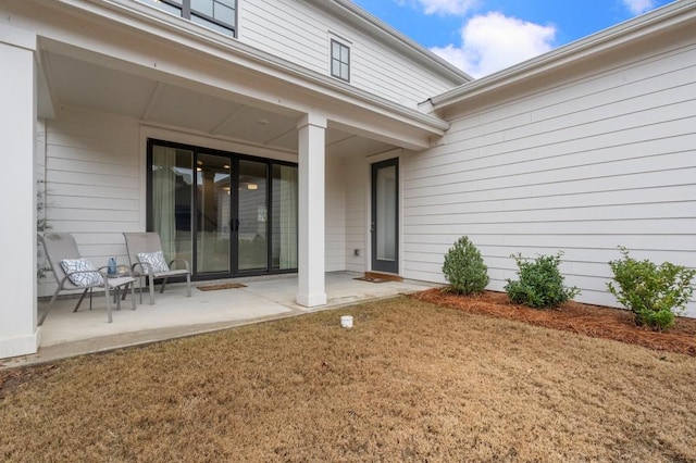 property entrance featuring a patio