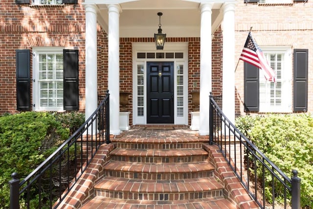 property entrance with brick siding