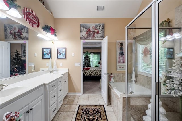 261 Double Springs Rd SW, Monroe, GA 30656 - bathroom featuring ensuite bathroom, tile patterned floors, double vanity, and tiled shower