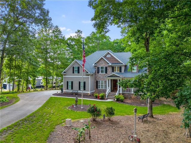 261 Double Springs Rd SW, Monroe, GA 30656 - craftsman house featuring a front lawn, a porch, stone siding, and board and batten siding