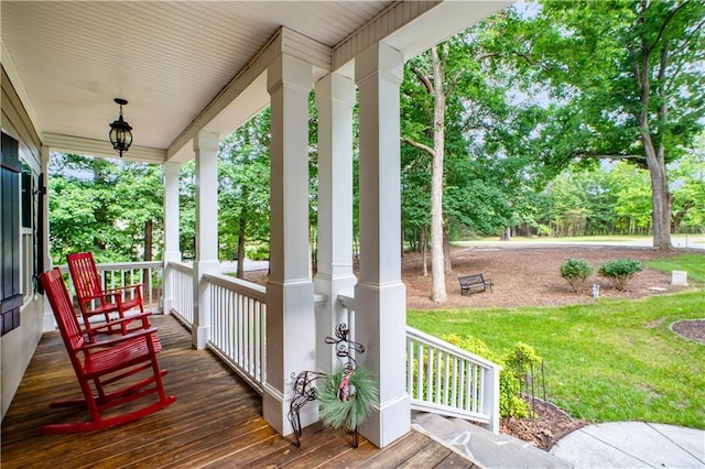 261 Double Springs Rd SW, Monroe, GA 30656 - deck with a porch, a lawn, and view of wooded area