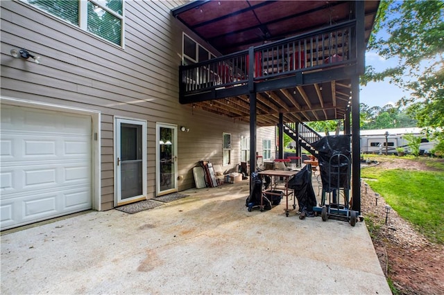 261 Double Springs Rd SW, Monroe, GA 30656 - view of patio / terrace featuring stairway, a wooden deck, and a garage