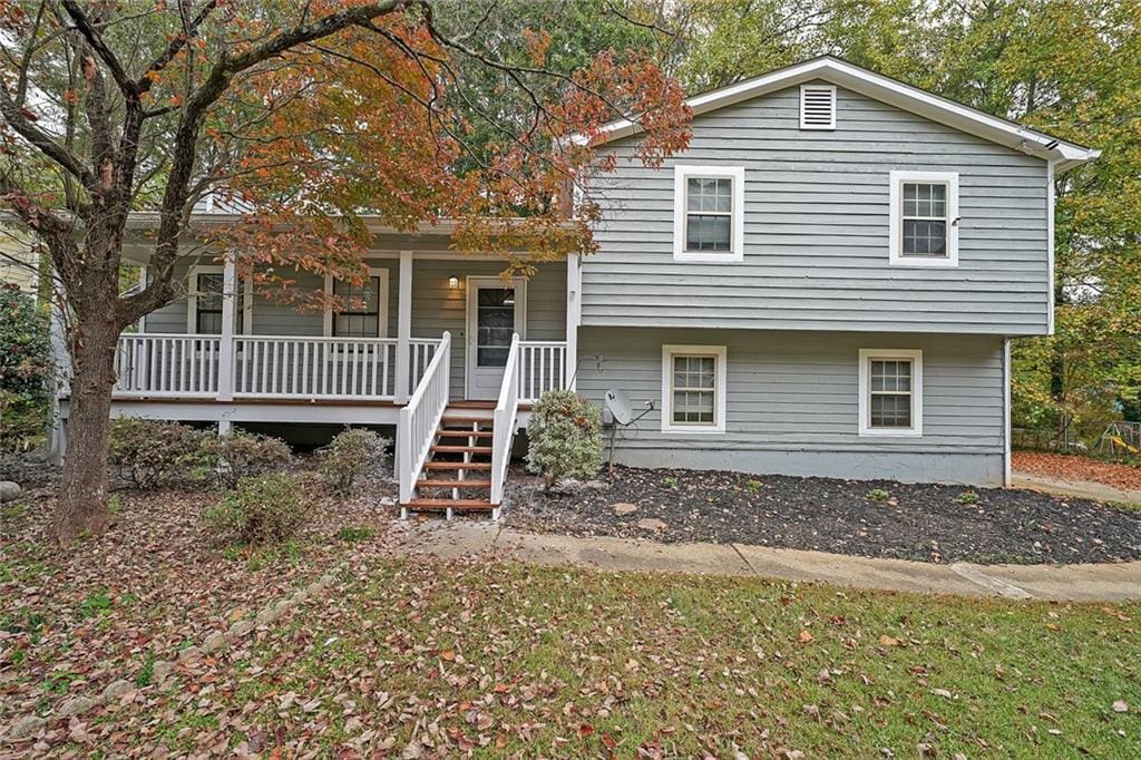 tri-level home featuring covered porch