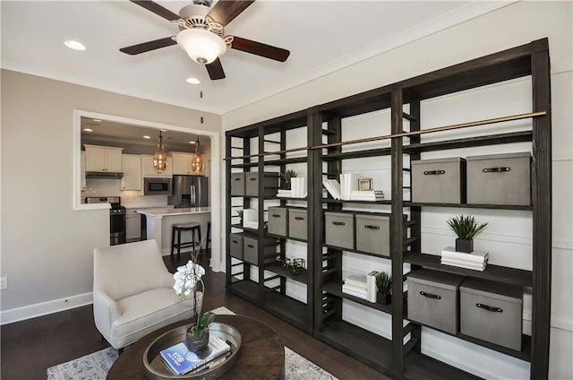 sitting room featuring ceiling fan and dark wood-type flooring