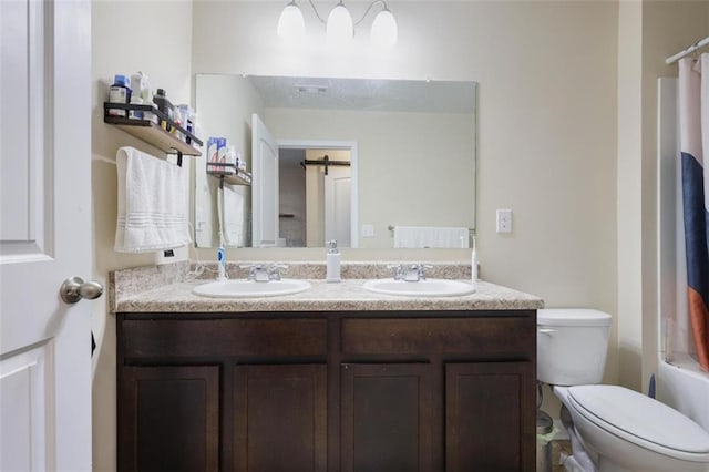 full bath featuring double vanity, shower / bath combination with curtain, toilet, and a sink