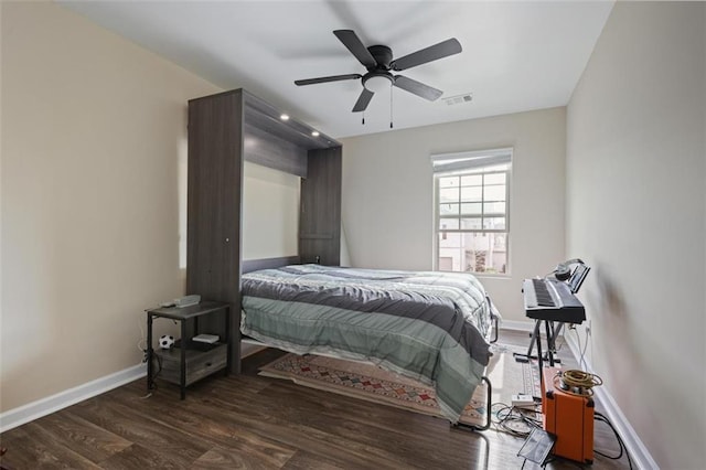 bedroom with visible vents, ceiling fan, baseboards, and wood finished floors