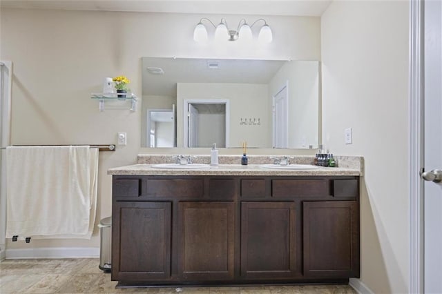 bathroom with double vanity and a sink