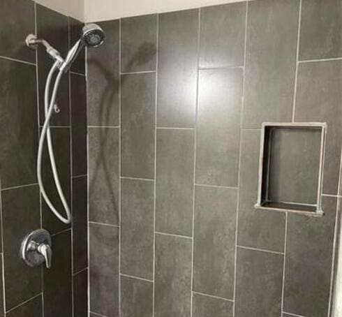 room details with a tile shower