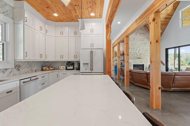 kitchen featuring wooden ceiling, white appliances, light stone countertops, decorative backsplash, and white cabinets