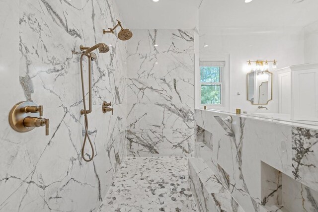 bathroom with a tile shower