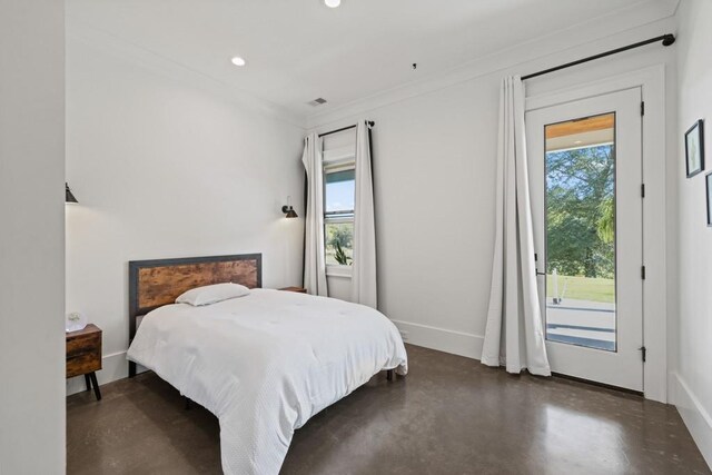 bedroom with ornamental molding and access to exterior