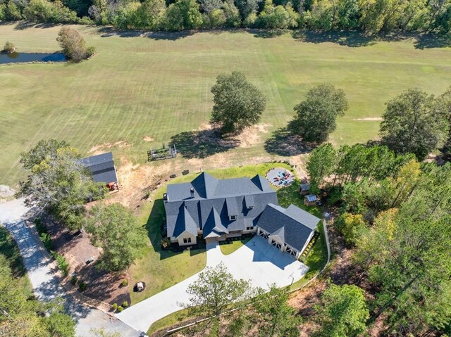 birds eye view of property with a rural view