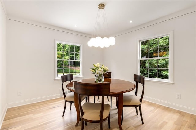 1327 Harvard Rd NE, Atlanta, GA 30306 - dining area with light wood finished floors, baseboards, and a chandelier