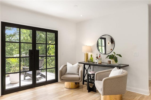 1327 Harvard Rd NE, Atlanta, GA 30306 - sitting room featuring french doors, light wood-style flooring, and baseboards