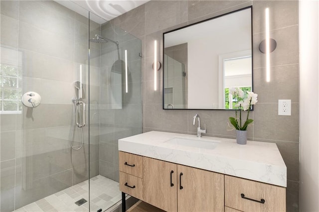 1327 Harvard Rd NE, Atlanta, GA 30306 - bathroom with tile walls, a shower stall, vanity, and plenty of natural light
