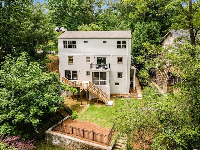 1327 Harvard Rd NE, Atlanta, GA 30306 - rear view of property featuring stairs, view of wooded area, a sunroom, fence, and a balcony