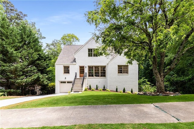 1327 Harvard Rd NE, Atlanta, GA 30306 - traditional home featuring a front yard, driveway, and an attached garage