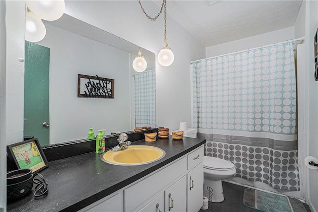 bathroom featuring vanity, toilet, and a shower with shower curtain