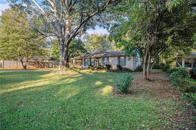 view of front of property with a carport and a front yard