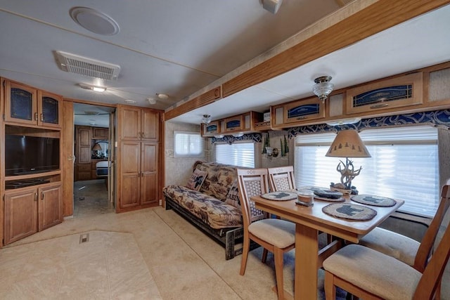 dining room featuring visible vents