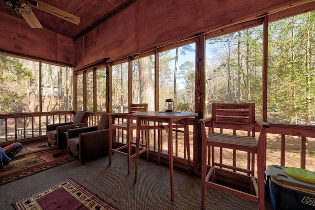 sunroom with ceiling fan and a healthy amount of sunlight