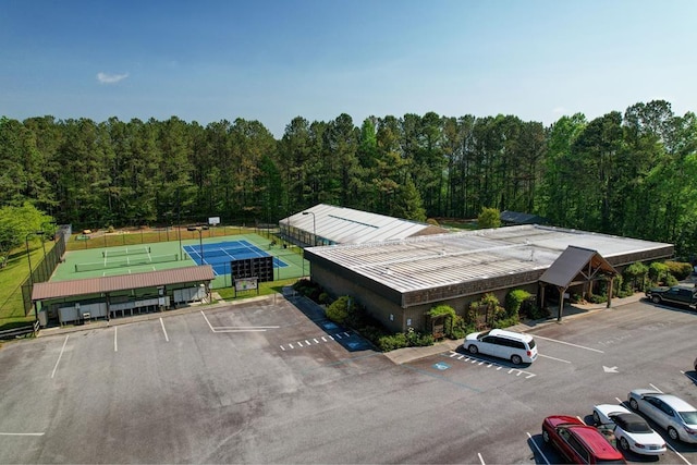 birds eye view of property with a wooded view