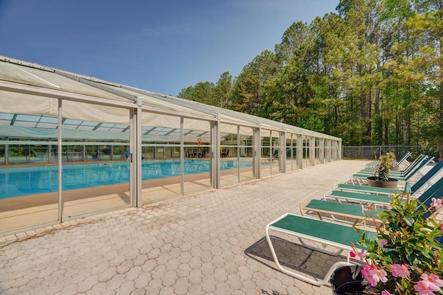 view of swimming pool with a fenced in pool