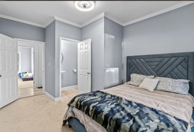 bedroom featuring ornamental molding and light carpet