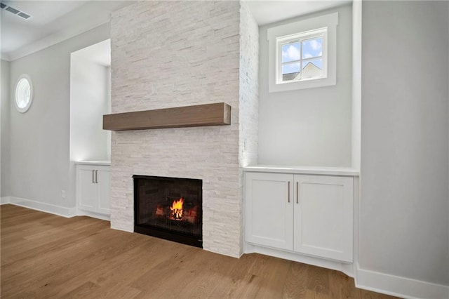 591 Brashy St, Woodstock, GA 30188 - unfurnished living room featuring wood finished floors, a fireplace, and baseboards