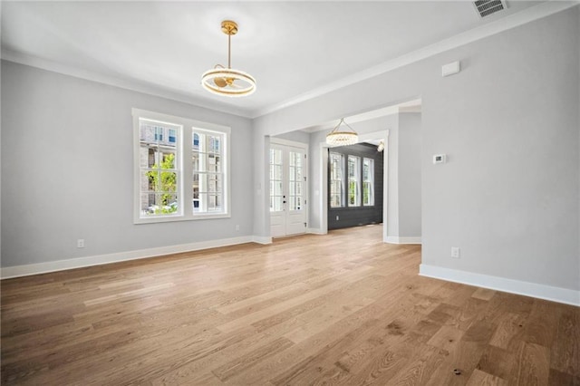 591 Brashy St, Woodstock, GA 30188 - unfurnished living room featuring plenty of natural light, crown molding, baseboards, and light wood-style flooring