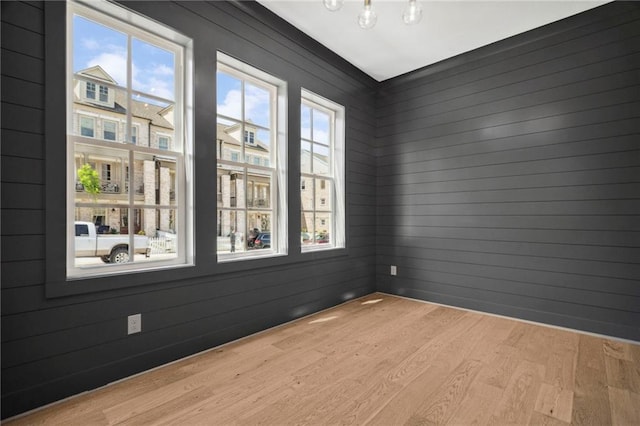 591 Brashy St, Woodstock, GA 30188 - spare room featuring wood finished floors and wooden walls