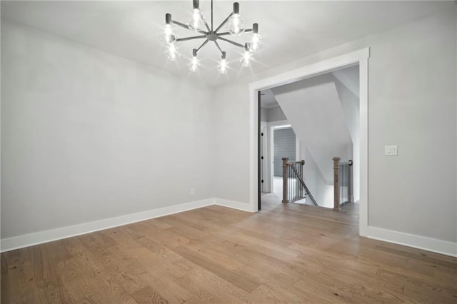 591 Brashy St, Woodstock, GA 30188 - unfurnished dining area featuring a chandelier, light wood finished floors, and baseboards