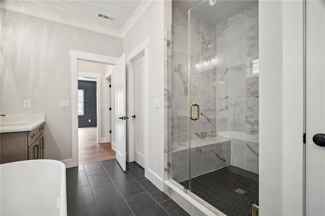 591 Brashy St, Woodstock, GA 30188 - bathroom with a shower stall, vanity, a freestanding bath, ornamental molding, and tile patterned flooring