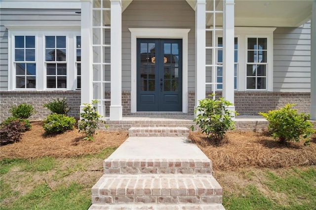 591 Brashy St, Woodstock, GA 30188 - entrance to property featuring brick siding, french doors, and a porch