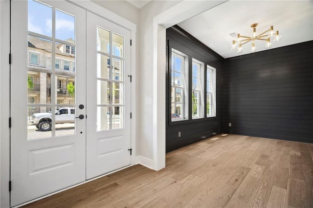 591 Brashy St, Woodstock, GA 30188 - entryway with a chandelier, light wood-style flooring, and baseboards