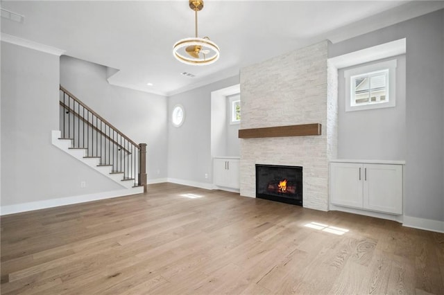591 Brashy St, Woodstock, GA 30188 - unfurnished living room featuring wood finished floors, a fireplace, baseboards, and crown molding